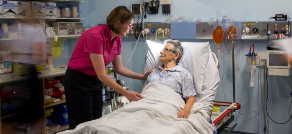 GEDI nurse with Older adult patient in the emergency department